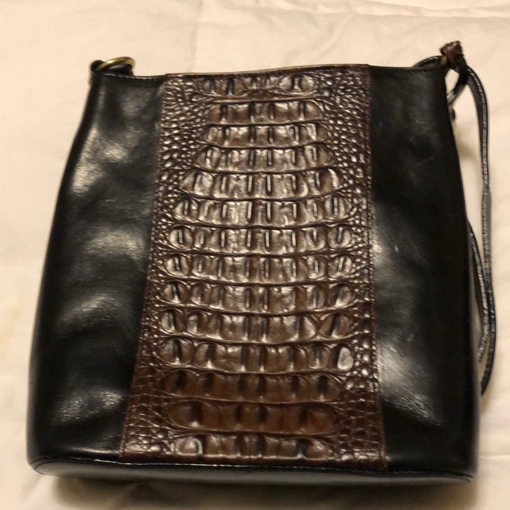 Black with brown alligator look on brown.  Adjusted strap.  Excellent condition